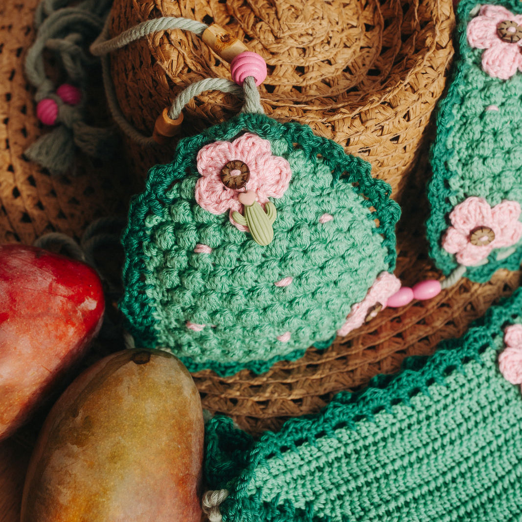 Green Pink Cactus luxury crochet bikini, designed and handmade in Switzerland by RA LIVING – exclusive designer beachwear and swimwear for a stylish summer look.