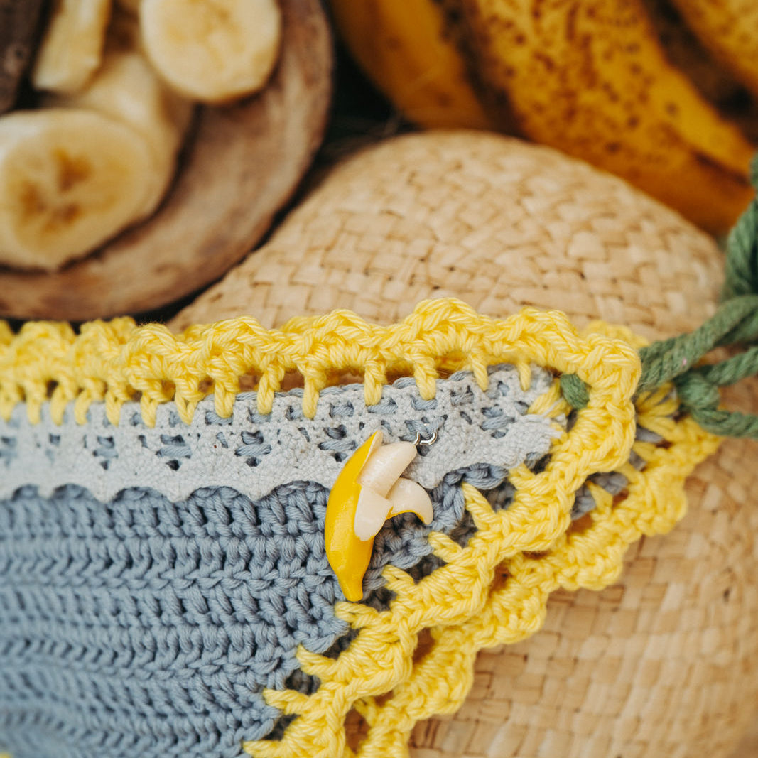 Grey Yellow Banana luxury crochet bikini, designed and handmade in Switzerland by RA LIVING – exclusive designer beachwear and swimwear for a stylish summer look.