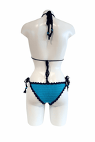 Classic Blue Evil Eye luxury crochet bikini, designed and handmade in Switzerland by RA LIVING – exclusive designer beachwear and swimwear for a stylish summer look.