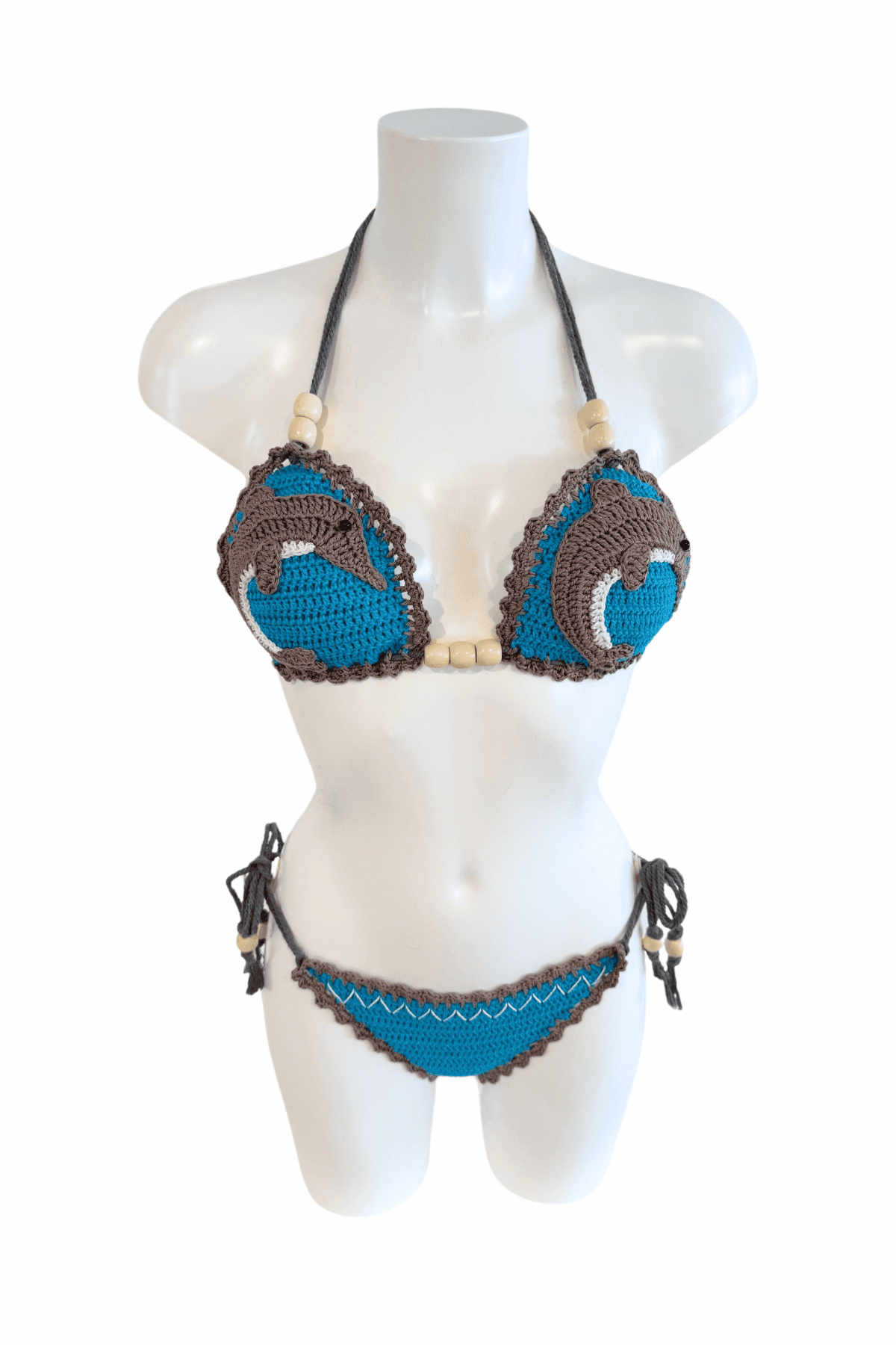 Dolphin luxury crochet bikini, designed and handmade in Switzerland by RA LIVING – exclusive designer beachwear and swimwear for a stylish summer look.