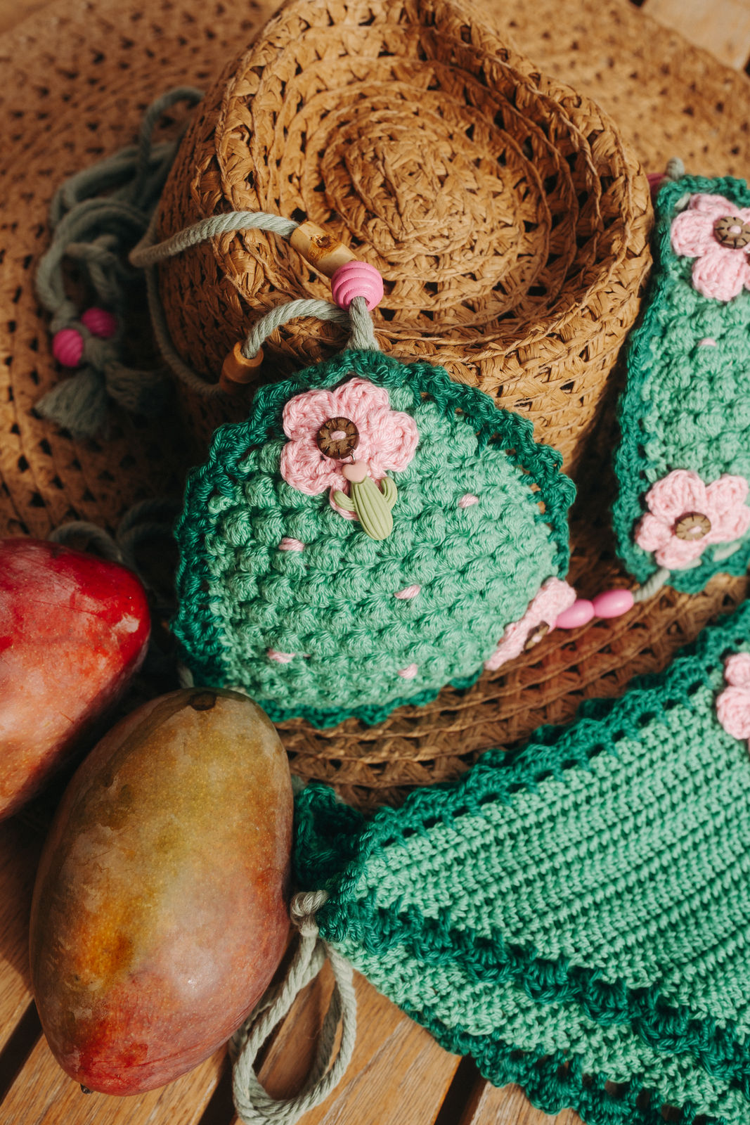 Green Pink Cactus luxury crochet bikini, designed and handmade in Switzerland by RA LIVING – exclusive designer beachwear and swimwear for a stylish summer look.