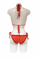 Orange Lobster luxury crochet bikini, designed and handmade in Switzerland by RA LIVING – exclusive designer beachwear and swimwear for a stylish summer look.