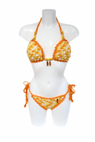 Yellow Orange Carrot luxury crochet bikini, designed and handmade in Switzerland by RA LIVING – exclusive designer beachwear and swimwear for a stylish summer look.