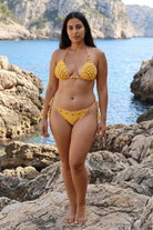 Sunny Pearls crochet bikini on a curvy model, front view - RA LIVING, handmade in Switzerland
